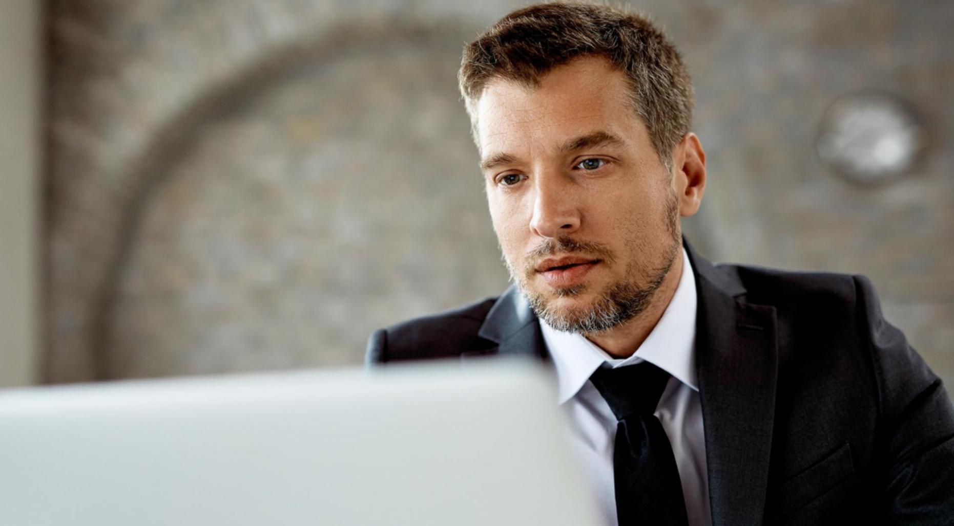 Financial education session with diverse participants discussing real-world money management strategies